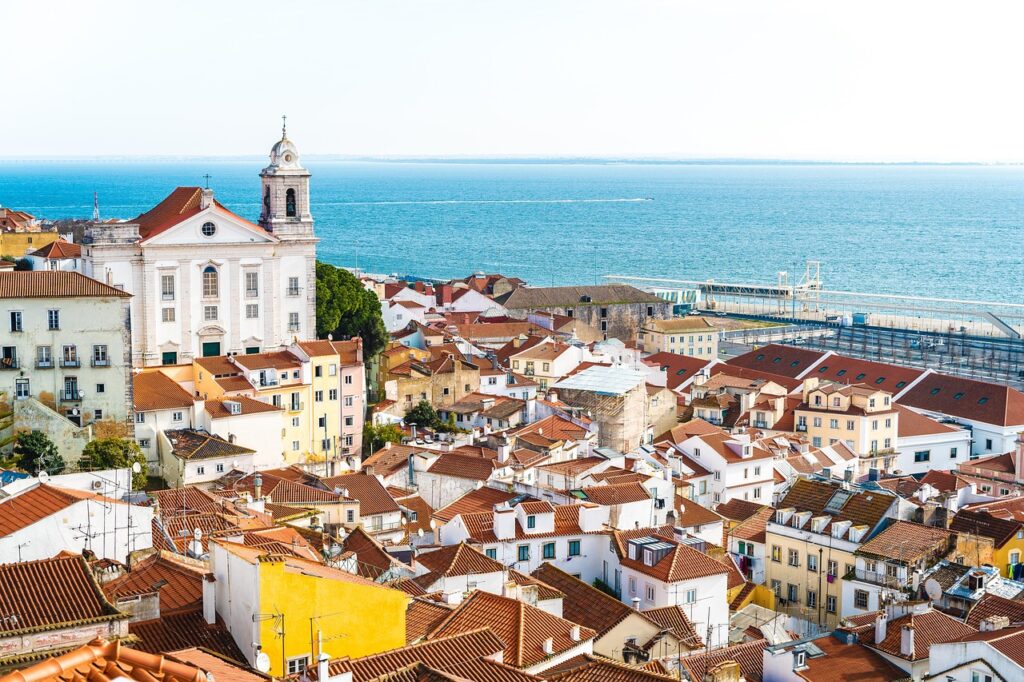 Sunset over Alfama rooftops Colorful rooftops and Lisbon's historic tram at sunset