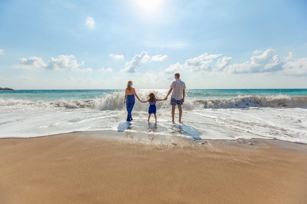 Young family enjoying affordable luxury travel at a stylish beach resort