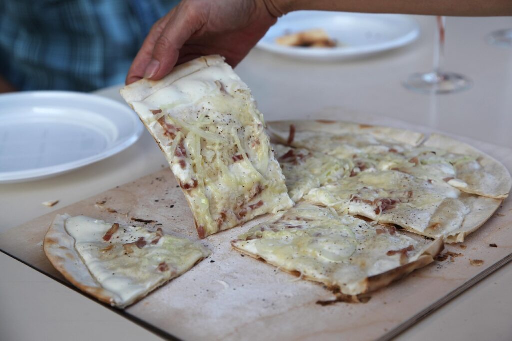 Traditional Alsatian flammenkueche — gourmet yet budget-friendly