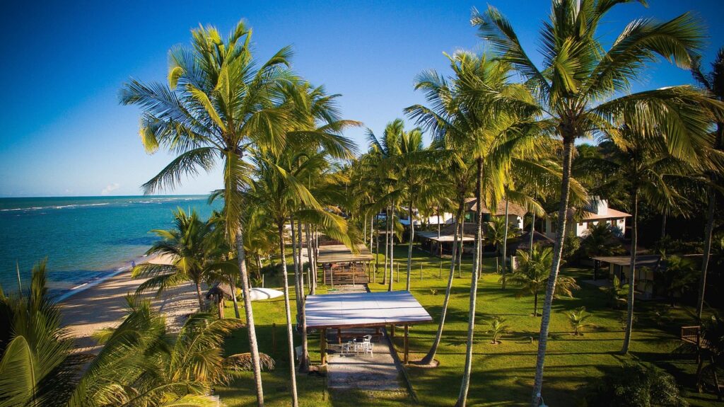 Luxury beachfront resort with infinity pool at sunset, representing timeshare vacation packages.