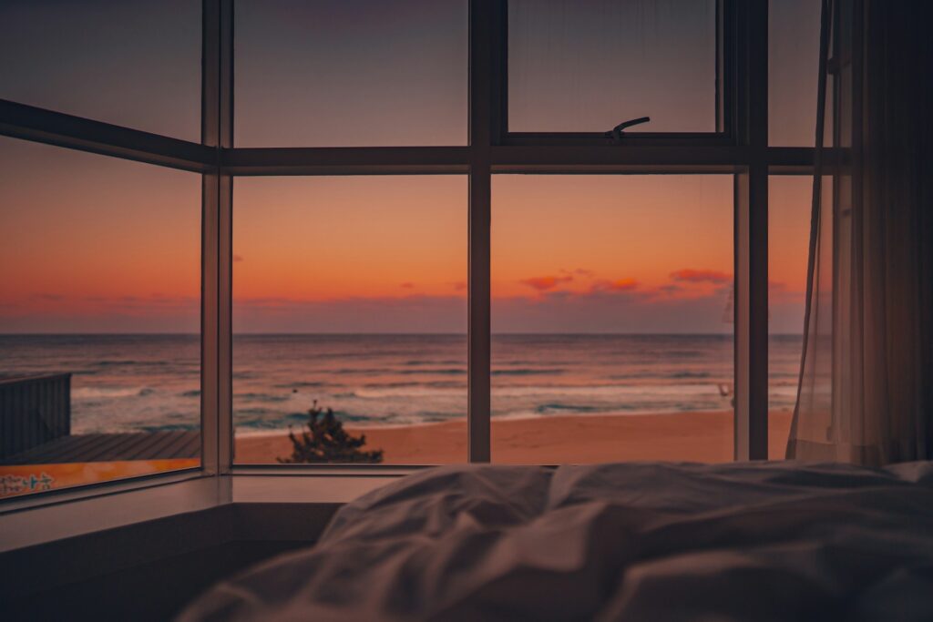 Romantic luxury hotel room with ocean view, ideal for couples on an affordable getaway in 2025