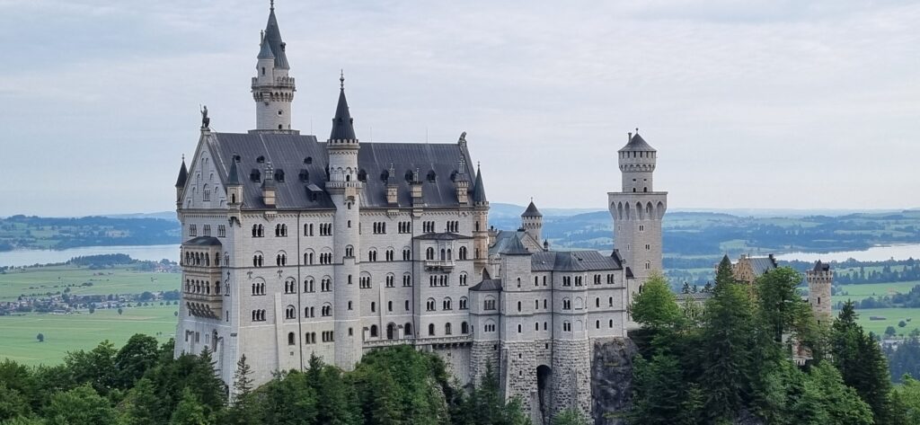 raveler's view of Neuschwanstein Castle in Germany, demonstrating the affordable luxury travel possible when knowing how airline yield management sets prices.