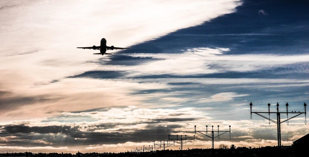 malaga-airport-1132629_1280 Commercial airplane taking off at sunset — representing global airline networks