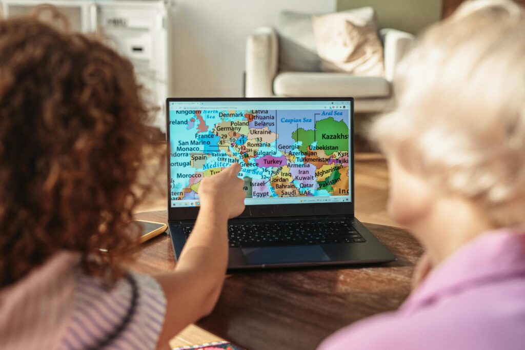Traveler researching the best day to buy airline tickets on a laptop, using insider strategies to save money on flights.